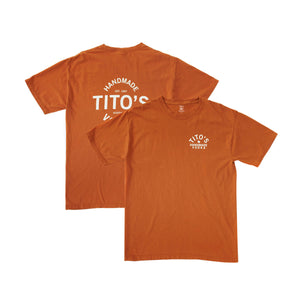 Front and back of orange short-sleeved t-shirt with Tito's Handmade Vodka design