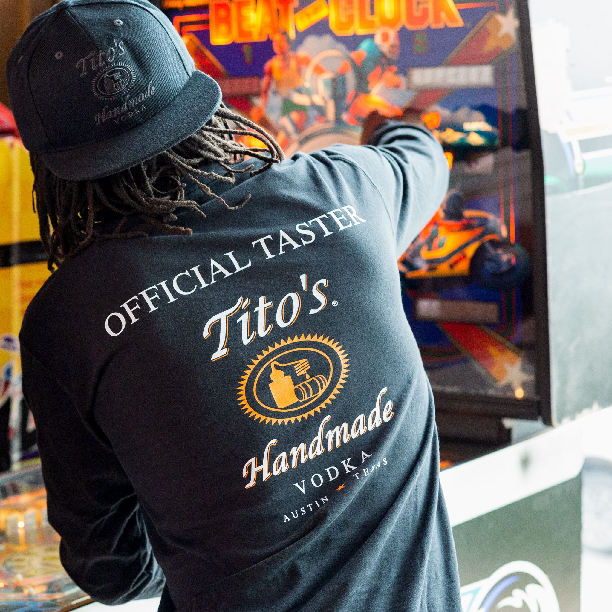 Man wearing black long-sleeved t-shirt with Official Tito's Taster mark
