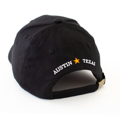 Back of Black Tito's Handmade Vodka with Austin, Texas across the back 