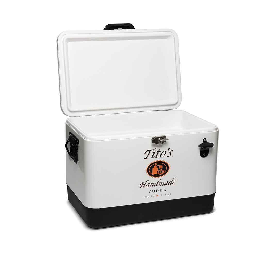 Front open view of white cooler with stainless steel hardware accessories and bottle opener on front with Tito's Handmade Vodka Logo