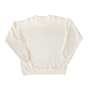 Back view of cream colored long sleeve crewneck pullover
