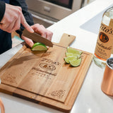 Man cutting limes on Tito's Cocktail Hour Cutting Board