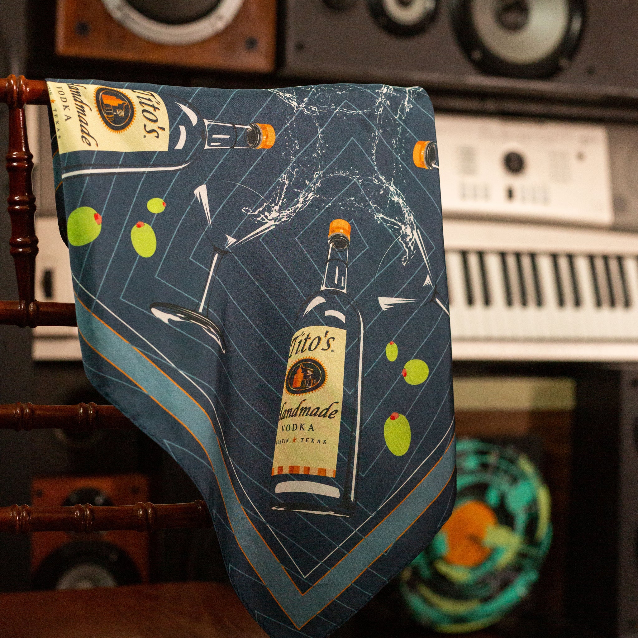 Navy silk scarf with illustrated Tito's Handmade Vodka bottle, martini glass, and green olives