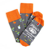 Gray and orange half-calf socks with Tito’s Vodka logo and various cocktails printed on