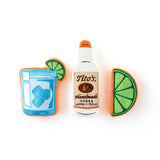 Front view of Tito's Bottle Toy with Tito's Handmade Vodka logo, Tito's Puptail squeeze toy, and Tito's Squeeze lime toy