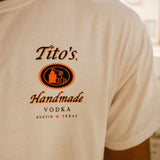 Front left breast of short-sleeve white t-shirt with Tito's Handmade Vodka logo