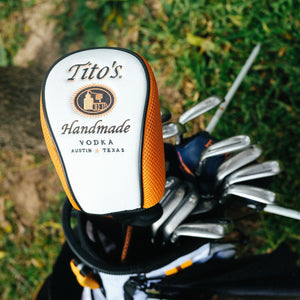Tito's golf head cover on a club in a golf bag 