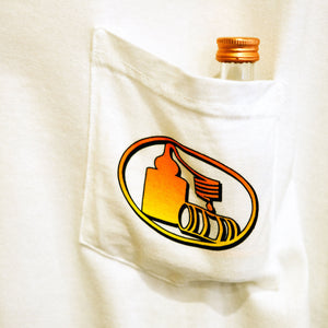 Close-up of left breast pocket with pot still design in an orange to yellow fade