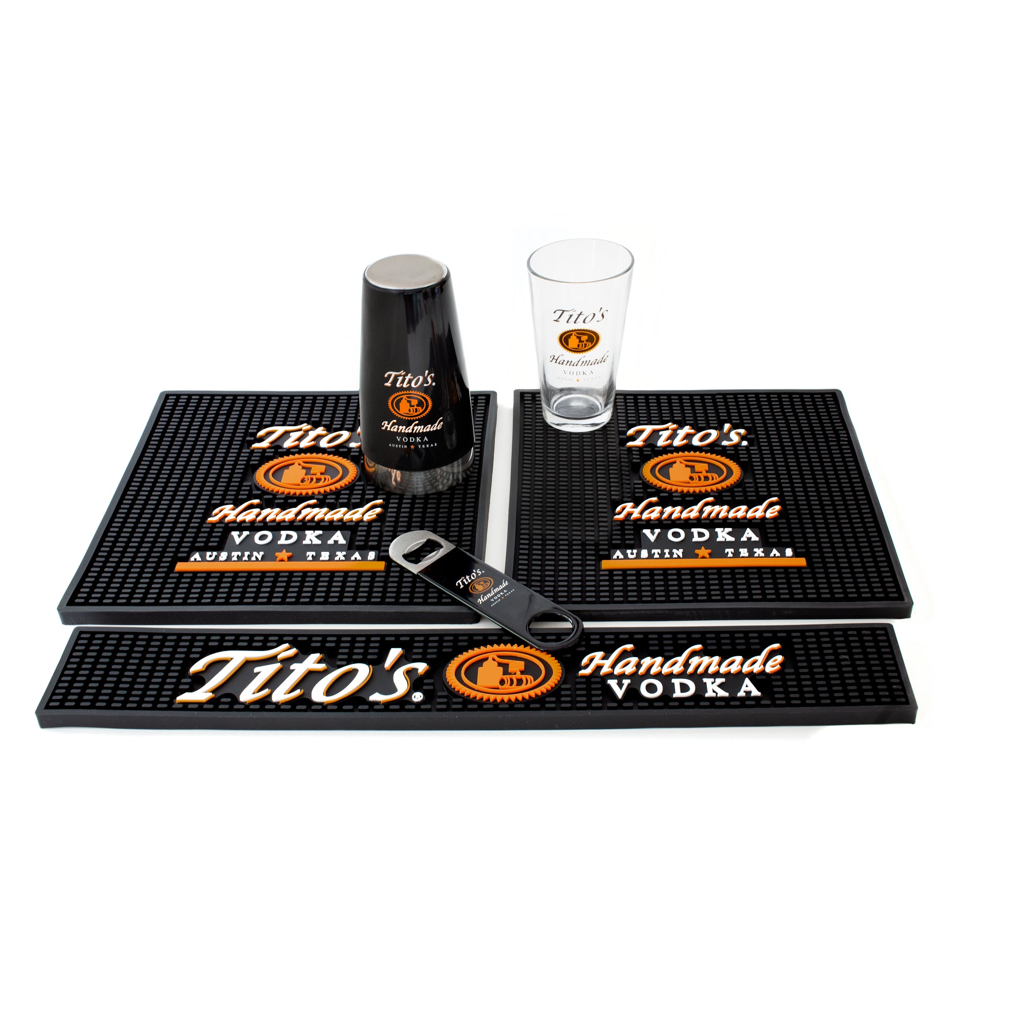 Kit includes: 1 Tito's rail mat, 2 Tito's square mats, one Tito's bottle opener, and one Tito's shaker and pint glass set