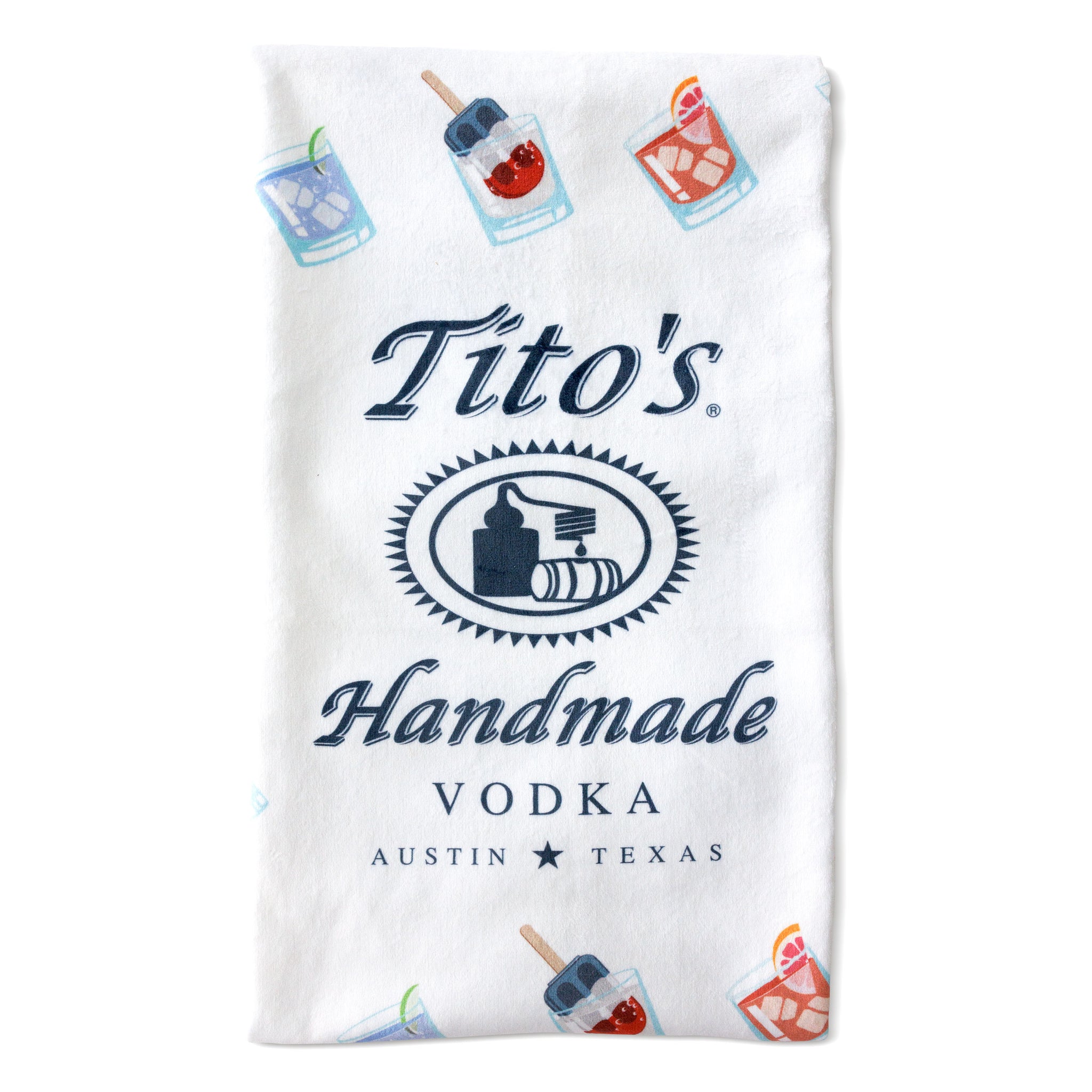 Folded white towel with Tito's Handmade Vodka logo and assorted cocktail illustrations