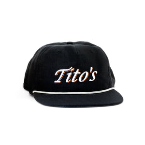 Front of black snapback with Tito's embroidered in white text and orange outline