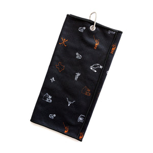 Back of black golf towel with golf and cocktail illustrations, and silver metal carabiner