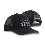 Front and back view of black trucker hat with embroidered Love, Tito's logo on the front and Austin Texas on the back
